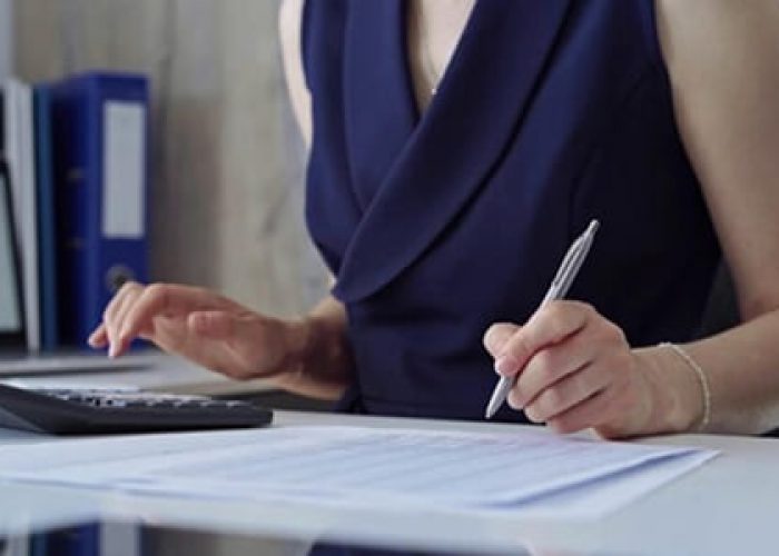 businesswoman with blue dress is using dark calculator taking notes her office taxes audit business 663268 3509.jpg uidP104266436gaGA1.1.502125966.1731996513semtais authors boost